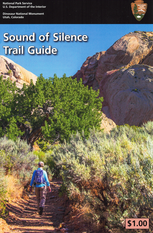 Trail guide cover with a hiking scene and mountain landscape